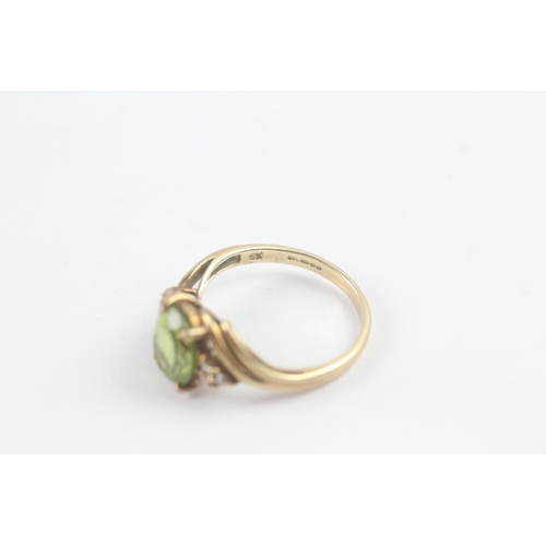 145 - 9ct gold peridot & diamond dress ring (2.6g) Size N