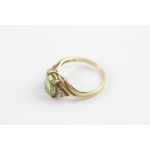 145 - 9ct gold peridot & diamond dress ring (2.6g) Size N