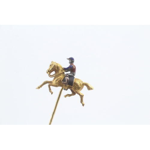 16 - 18ct gold enamel on silver jockey on racehorse stick pin - 15ct pin (3.6g)