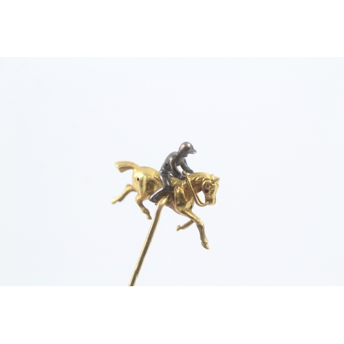 16 - 18ct gold enamel on silver jockey on racehorse stick pin - 15ct pin (3.6g)