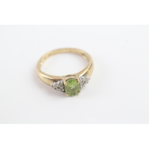 164 - 9ct gold peridot & diamond dress ring (2.1g) Size M