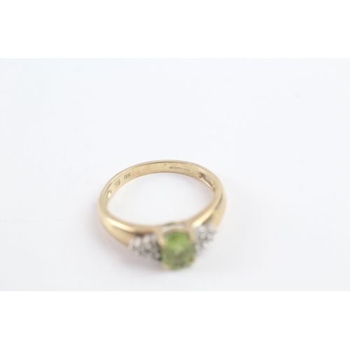 164 - 9ct gold peridot & diamond dress ring (2.1g) Size M