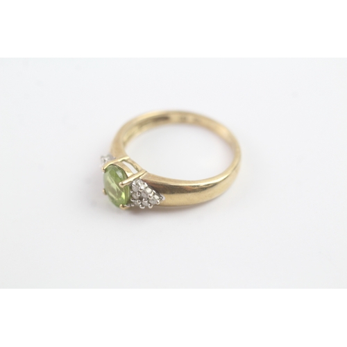 164 - 9ct gold peridot & diamond dress ring (2.1g) Size M