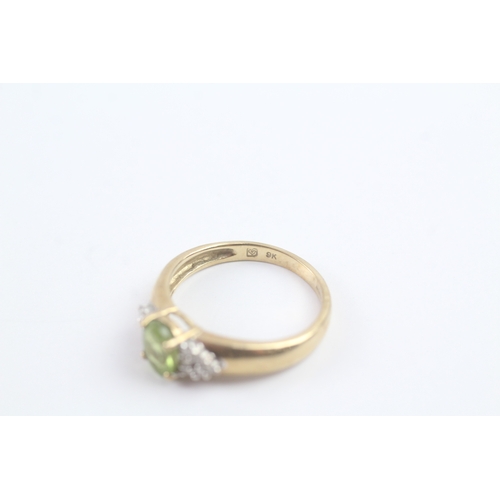 164 - 9ct gold peridot & diamond dress ring (2.1g) Size M