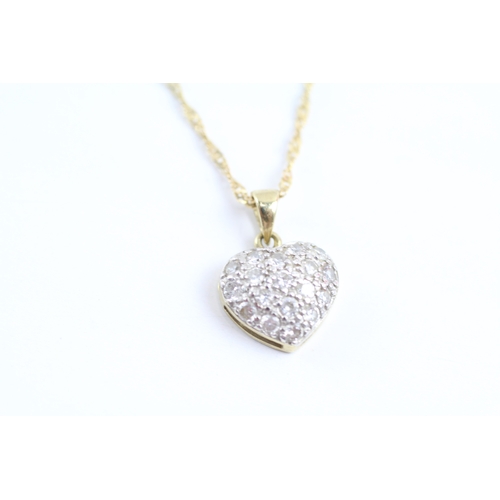 174 - 9ct gold diamond heart pendant necklace (1.8g)