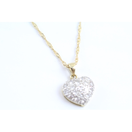 174 - 9ct gold diamond heart pendant necklace (1.8g)