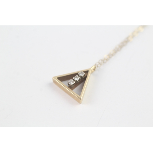 188 - 9ct gold diamond triangle pendant on chain (1.8g)