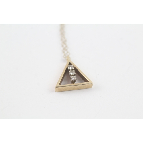 188 - 9ct gold diamond triangle pendant on chain (1.8g)