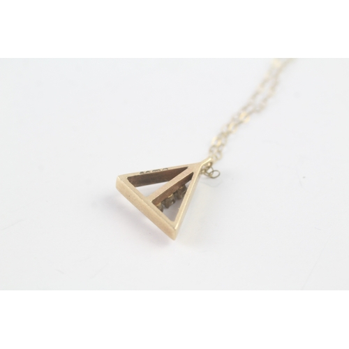 188 - 9ct gold diamond triangle pendant on chain (1.8g)