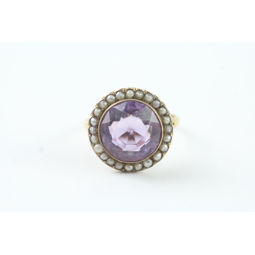 203 - 18ct gold amethyst and seed pearl halo ring (4.9g) Size R