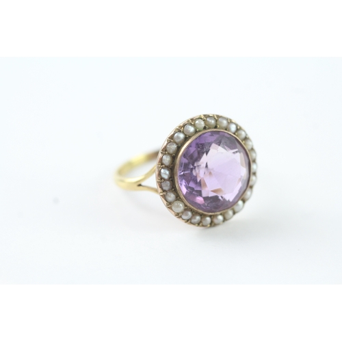 203 - 18ct gold amethyst and seed pearl halo ring (4.9g) Size R