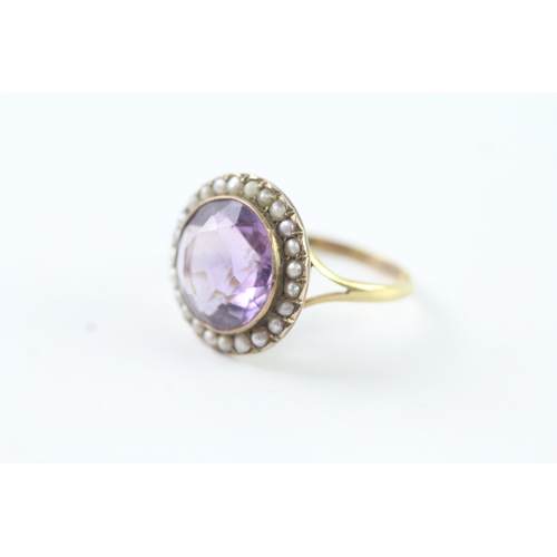 203 - 18ct gold amethyst and seed pearl halo ring (4.9g) Size R