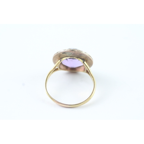 203 - 18ct gold amethyst and seed pearl halo ring (4.9g) Size R