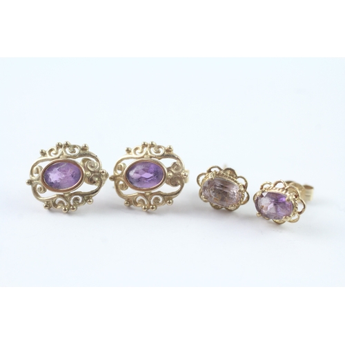 211 - 2 x 9ct gold amethyst stud earrings (2.4g)