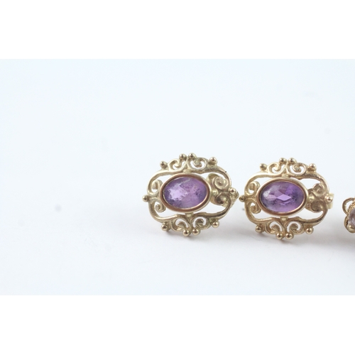 211 - 2 x 9ct gold amethyst stud earrings (2.4g)