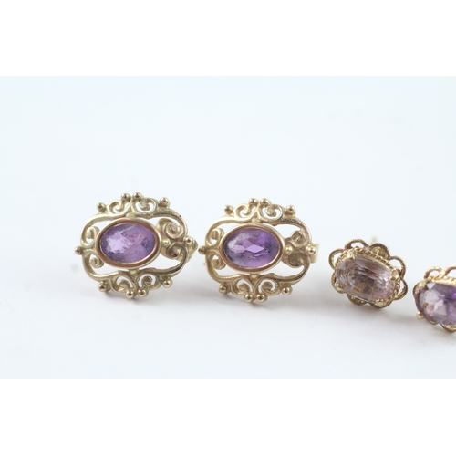 211 - 2 x 9ct gold amethyst stud earrings (2.4g)