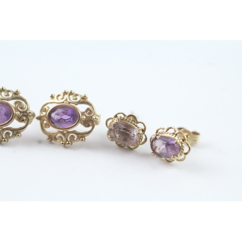 211 - 2 x 9ct gold amethyst stud earrings (2.4g)