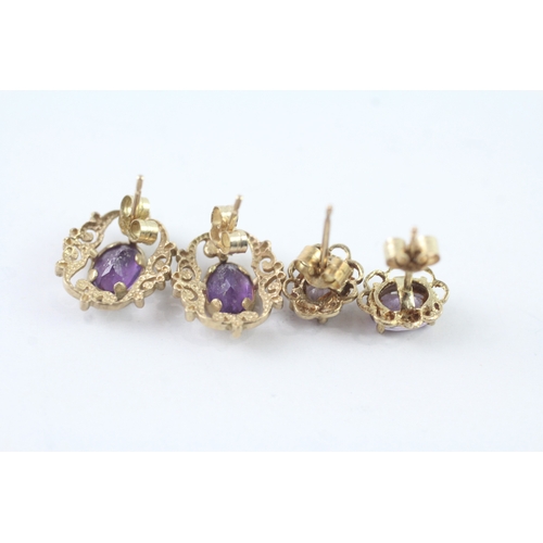 211 - 2 x 9ct gold amethyst stud earrings (2.4g)