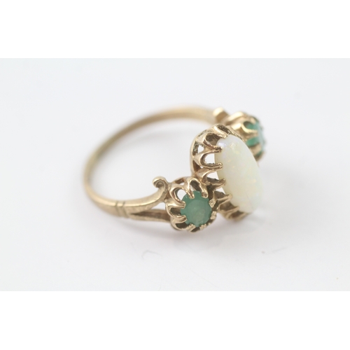 214 - 9ct gold opal and emerald trilogy ring (4.4g) Size R 1/2