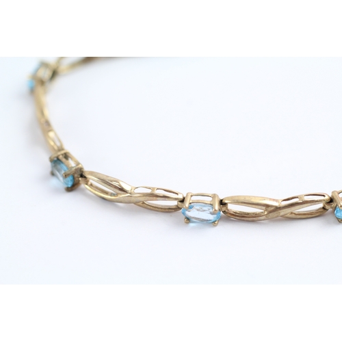 240 - 9ct gold oval cut blue gemstone bracelet (4.5g)