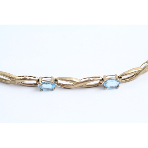 240 - 9ct gold oval cut blue gemstone bracelet (4.5g)