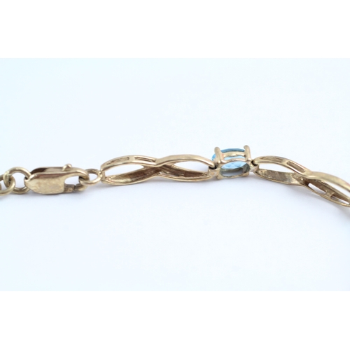 240 - 9ct gold oval cut blue gemstone bracelet (4.5g)