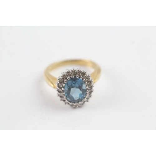 243 - 18ct gold diamond and topaz halo ring (5.5g) Size K