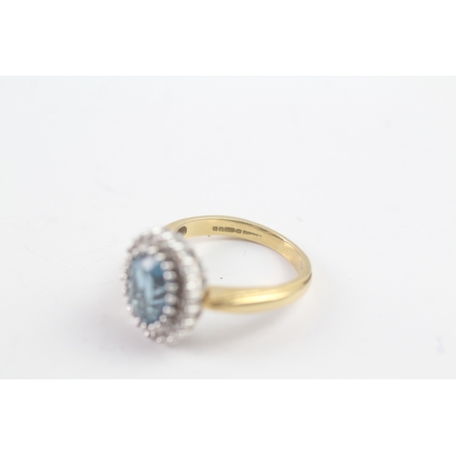 243 - 18ct gold diamond and topaz halo ring (5.5g) Size K