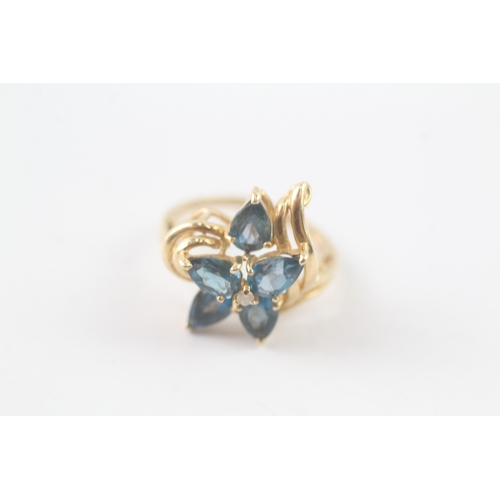 248 - 10ct gold blue gemstone and diamond floral ring (3.5g) Size I