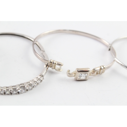 259 - Collection of Sterling Silver CZ Bangles inc. Bypass, Graduated, Faceted x 4 45g