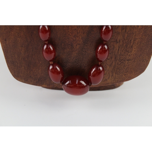 261 - Graduated Cherry Bakelite Necklace w/ Internal Streaking 53.8g