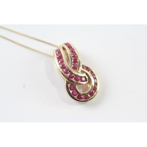 28 - 9ct gold ruby infinity knot pendant necklace (3.1g)