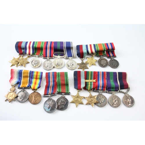 384 - Mounted Miniature Medal Groups Inc WW1, WW2 RAF, Palestine, Etc x 5