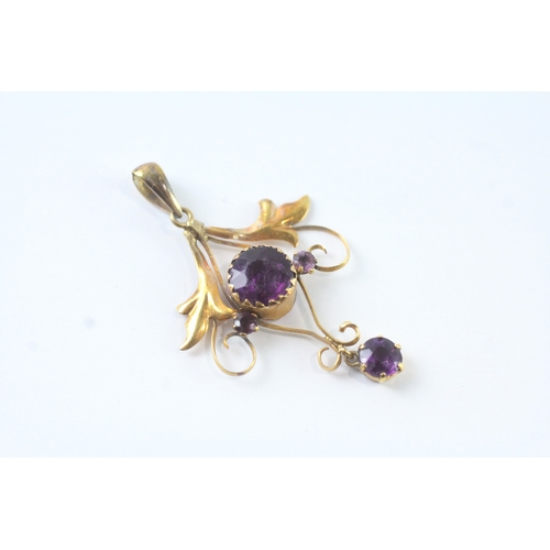 43 - 9ct gold purple gemstone floral pendant (1.2g)