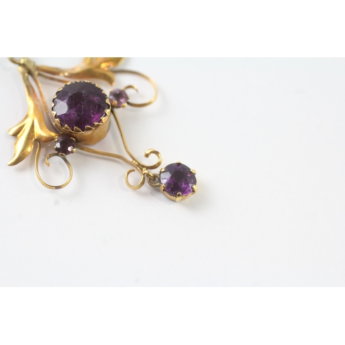 43 - 9ct gold purple gemstone floral pendant (1.2g)