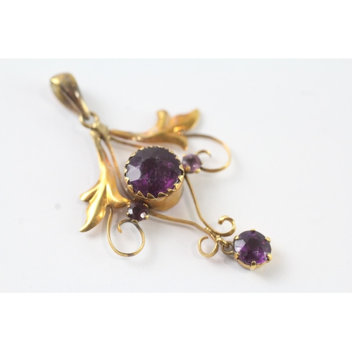 43 - 9ct gold purple gemstone floral pendant (1.2g)