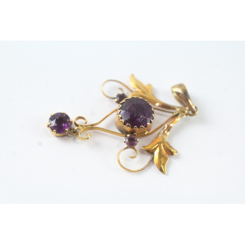 43 - 9ct gold purple gemstone floral pendant (1.2g)