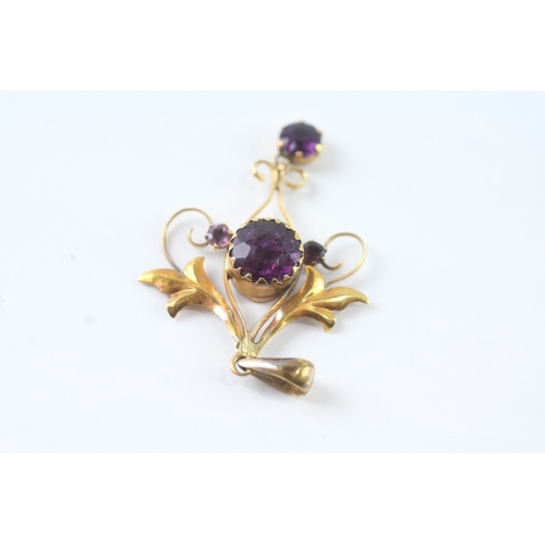 43 - 9ct gold purple gemstone floral pendant (1.2g)