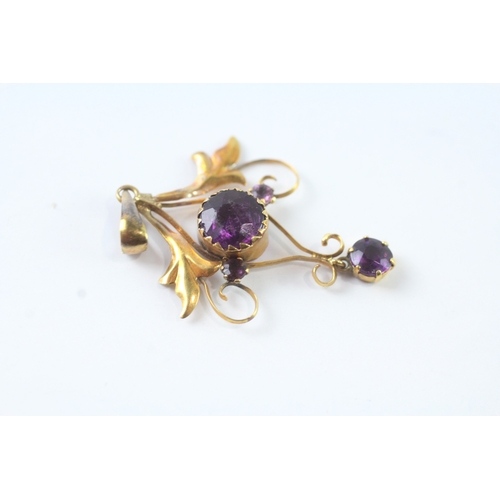 43 - 9ct gold purple gemstone floral pendant (1.2g)