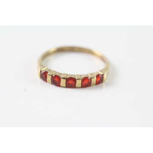 51 - 9ct gold orange gemstone half eternity ring (2.3g) Size U