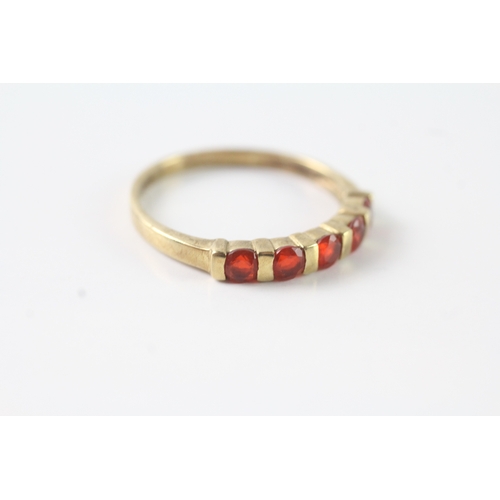 51 - 9ct gold orange gemstone half eternity ring (2.3g) Size U