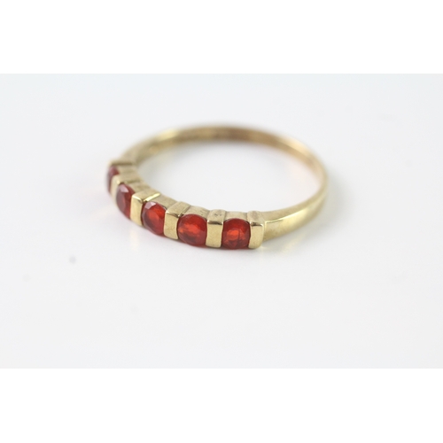 51 - 9ct gold orange gemstone half eternity ring (2.3g) Size U