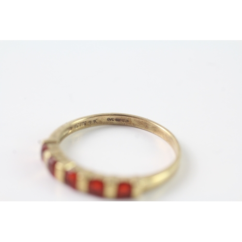 51 - 9ct gold orange gemstone half eternity ring (2.3g) Size U