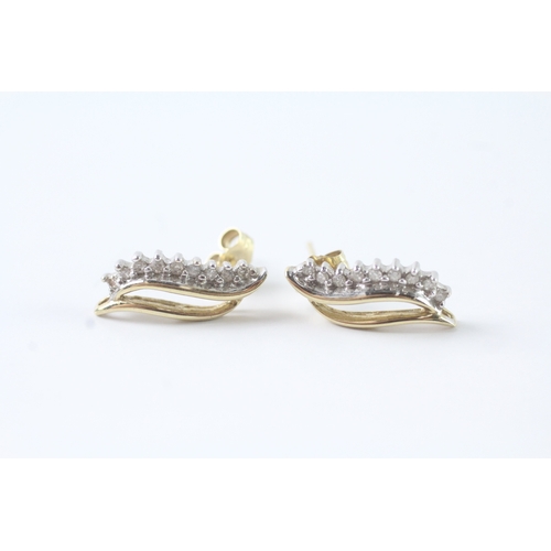 54 - 9ct gold diamond leaf form stud earrings (1.4g)