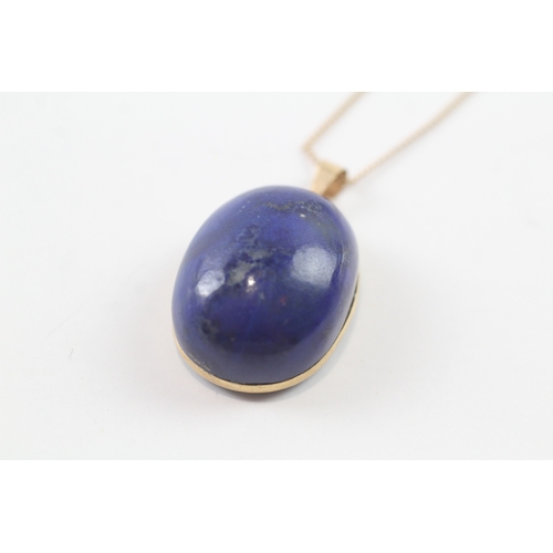 96 - 18ct gold lapis pendant W/ 9ct gold chain (10.1g)