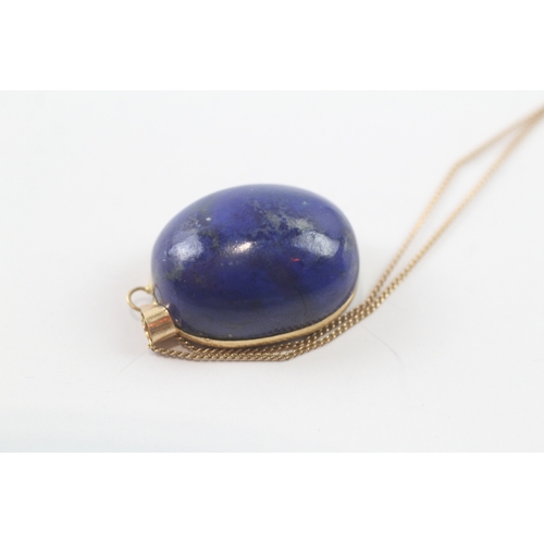 96 - 18ct gold lapis pendant W/ 9ct gold chain (10.1g)