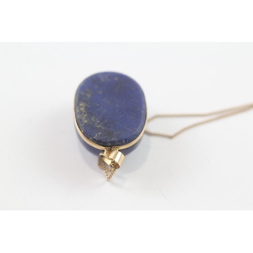 96 - 18ct gold lapis pendant W/ 9ct gold chain (10.1g)