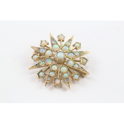 99 - 9ct gold opal star brooch (4.3g)