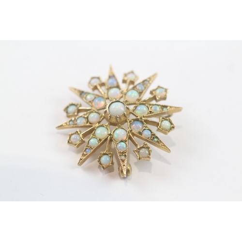 99 - 9ct gold opal star brooch (4.3g)