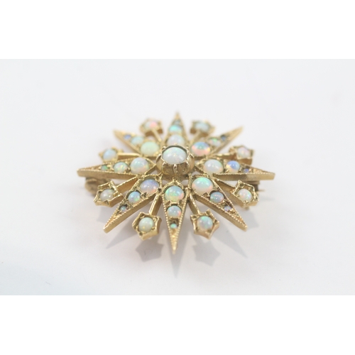 99 - 9ct gold opal star brooch (4.3g)